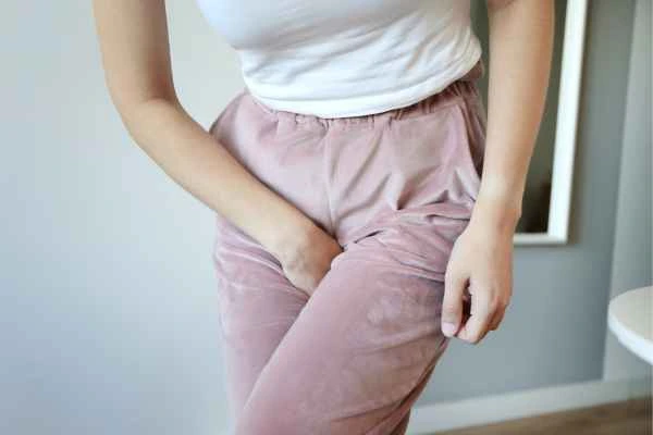 woman struggling with urine incontinence King's Norton